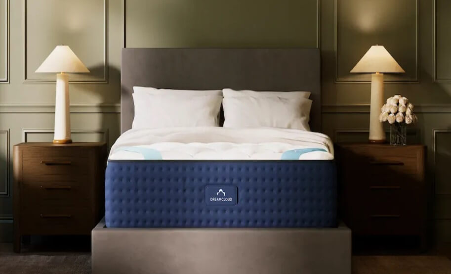 DreamCloud Premier Mattress with 2 pillows in bedroom.